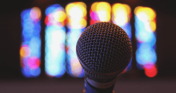 5 Ways to Communicate More Effectively with your Congregation Microphone in front of stained glass windows